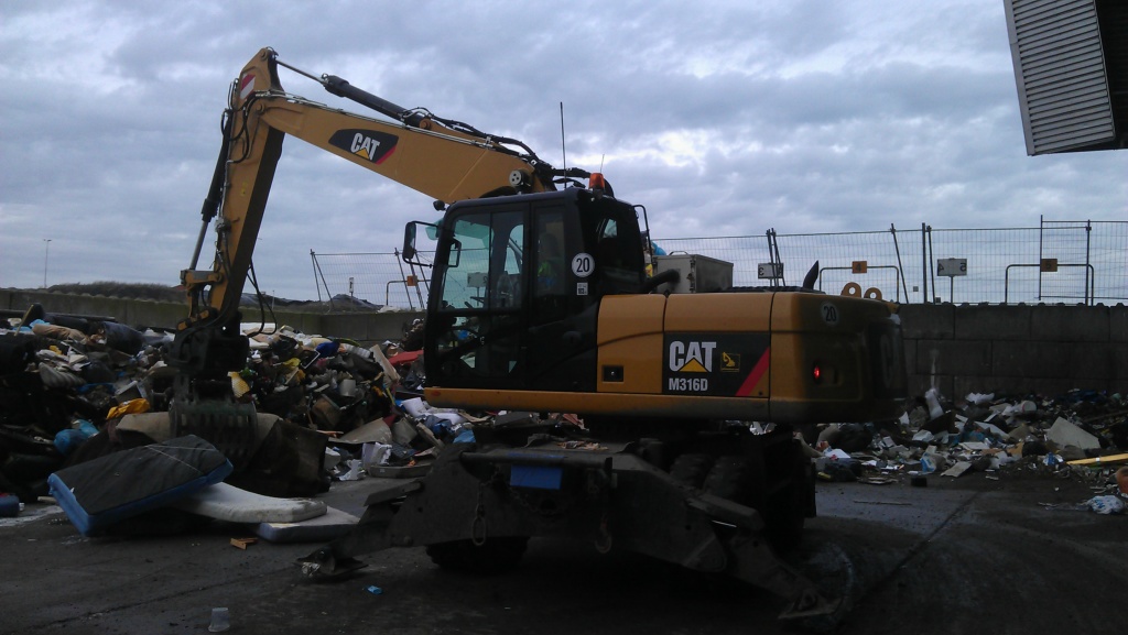 Household waste Caterpillar M316D wheeled excavator  with Arctic air Cab pressurizer.